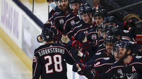 The Columbus Blue Jackets bench celebrates the goal scored by right wing Oliver Bjorkstrand (28) in the game against the Dallas Stars in the first period at Nationwide Arena.