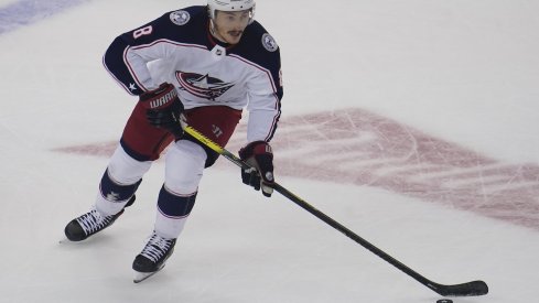 Columbus Blue Jackets defenseman Zach Werenski (8) skates on the ice for being named a star of the game, after scoring the game winning goal against the St. Louis Blues in the overtime period at Nationwide Arena. 