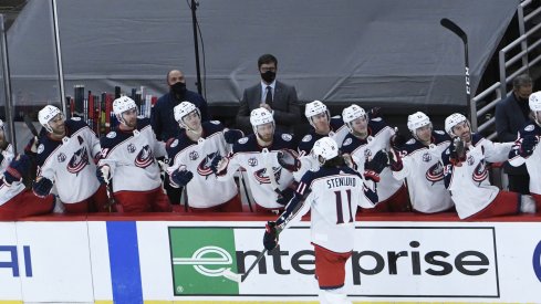 Feb 11, 2021; Chicago, Illinois, USA; Columbus Blue Jackets center Kevin Stenlund (11) celebrates his game winning goal against the Chicago Blackhawks during the third period at United Center.