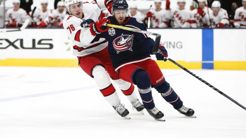 Carolina Hurricanes defenseman Brady Skjei (76) checks Columbus Blue Jackets center Boone Jenner (38) during the first period at Nationwide Arena.