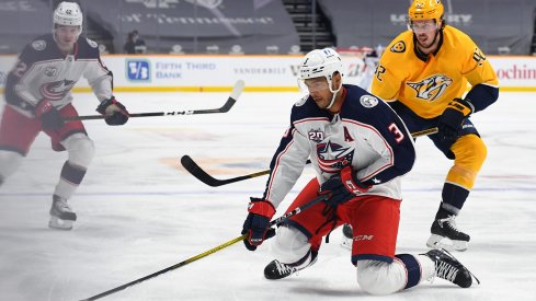 Columbus Blue Jackets defenseman Seth Jones controls the puck from his knees as he enters the offensive zone against the Nashville Predators during their first meeting of the season.