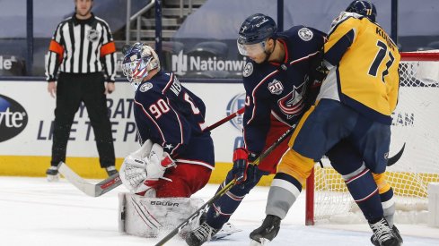 Feb 18, 2021; Columbus, Ohio, USA; Columbus Blue Jackets goalie Elvis Merzlikins (90) makes a save against the Nashville Predators during the second period at Nationwide Arena.