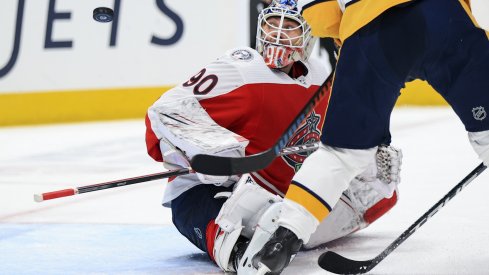 Columbus Blue Jackets goaltender Elvis Merzlikins follows the puck in the air in the game against the Nashville Predators in the second period at Nationwide Arena. 