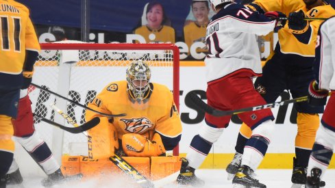 Nashville Predators goaltender Juuse Saros (74) makes a save during the first period against the Columbus Blue Jackets at Bridgestone Arena. 