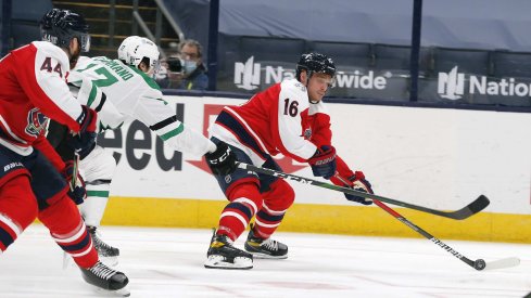 Feb 2, 2021; Columbus, Ohio, USA; Columbus Blue Jackets center Max Domi (16) carries the puck past Dallas Stars right wing Nick Caamano (17) during the third period at Nationwide Arena.