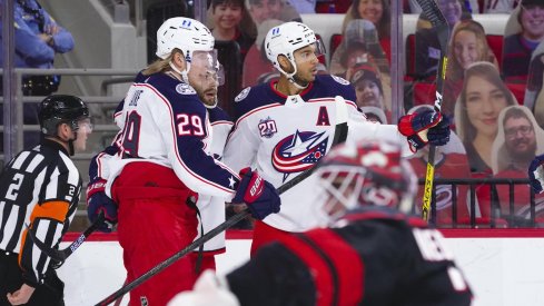 Columbus Blue Jackets defenseman Seth Jones (3) is congratulated by right wing Patrik Laine (29) after his first period goal against the Carolina Hurricanes at PNC Arena.