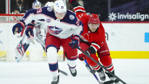 Columbus Blue Jackets right wing Patrik Laine (29) skates with the puck past Carolina Hurricanes right wing Jesper Fast (71) during the second period at PNC Arena.