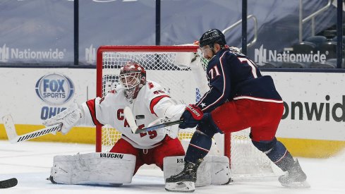 Mar 25, 2021; Columbus, Ohio, USA; Columbus Blue Jackets left wing Nick Foligno (71) swipes at a rebound after a Carolina Hurricanes goalie Alex Nedeljkovic (39) save during the third period at Nationwide Arena.