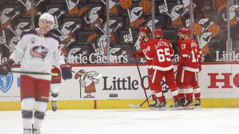 Detroit Red Wings center Michael Rasmussen (27) is congratulated by teammates after scoring in the third period against the Columbus Blue Jackets at Little Caesars Arena.