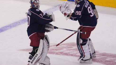 Columbus Blue Jackets goaltender Joonas Korpisalo (70) heads for the bench as he is replaced by goaltender Elvis Merzlikins (90) during the second period against the Toronto Maple Leafs in the Eastern Conference qualifications at Scotiabank Arena. 