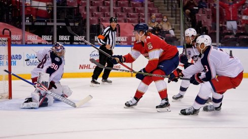 Columbus Blue Jackets goaltender Elvis Merzlikins (90) blocks the shot of Florida Panthers right wing Owen Tippett (74) during the second period at BB&T Center. 