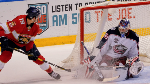 Columbus Blue Jackets goaltender Elvis Merzlikins (90) blocks the shot of Florida Panthers left wing Mason Marchment (19) during the third period at BB&T Center. 