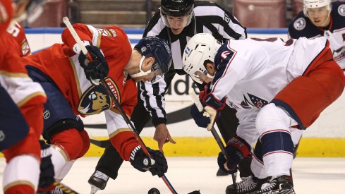 Apr 20, 2021; Sunrise, Florida, USA; Florida Panthers center Sam Bennett (9) and Columbus Blue Jackets center Jack Roslovic (96) face-off during the first period at BB&T Center.