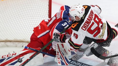 Yegor Chinakhov runs into goaltender Lars Johansson