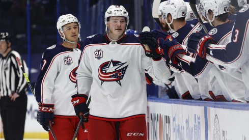 Apr 25, 2021; Tampa, Florida, USA; Columbus Blue Jackets left wing Eric Robinson (50) is congratulated as he scores a goal against the Tampa Bay Lightning during the third period at Amalie Arena.