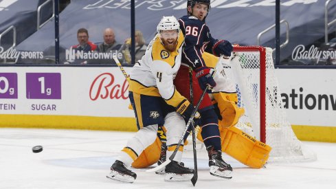 Columbus Blue Jackets center Jack Roslovic (96) and Nashville Predators defenseman Ryan Ellis (4) battle for position in front of the net during the first period at Nationwide Arena