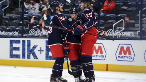 May 8, 2021; Columbus, Ohio, USA; Columbus Blue Jackets right wing Cam Atkinson (middle) celebrates with teammates center Jack Roslovic (left) and right wing Patrik Laine (right) after scoring a goal against the Detroit Red Wings in the 1st period at Nationwide Arena.
