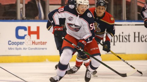 Eric Robinson skates with the puck against the Florida Panthers 