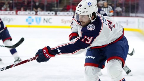  Columbus Blue Jackets center Liam Foudy (19) takes a first period shot against the Carolina Hurricanes at PNC Arena.