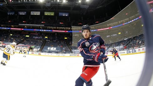 Columbus Blue Jackets center Jack Roslovic (96) passes the puck off the glass during the first period against the Nashville Predators at Nationwide Arena.