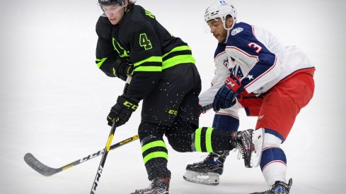 Mar 6, 2021; Dallas, Texas, USA; Dallas Stars defenseman Miro Heiskanen (4) is tripped by Columbus Blue Jackets defenseman Seth Jones (3) during the first period at the American Airlines Center.