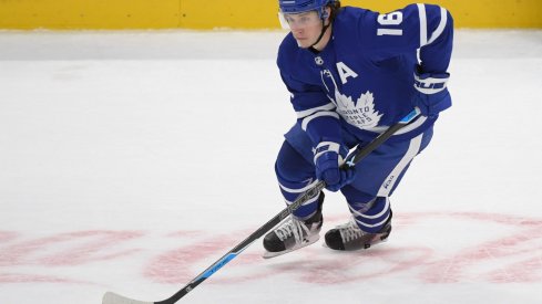 Apr 29, 2021; Toronto, Ontario, CAN; Toronto Maple Leafs forward Mitch Marner (16) skates with the puck against Vancouver Canucks in the third period at Scotiabank Arena.