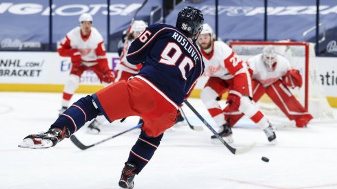 May 8, 2021; Columbus, Ohio, USA; Columbus Blue Jackets center Jack Roslovic (96) shoots and scores a goal against the Detroit Red Wings in the third period at Nationwide Arena.