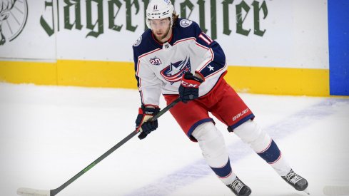 Mar 6, 2021; Dallas, Texas, USA; Columbus Blue Jackets center Kevin Stenlund (11) in action during the game between the Dallas Stars and the Columbus Blue Jackets at the American Airlines Center.