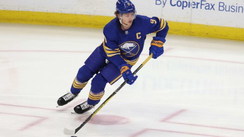 Feb 15, 2021; Buffalo, New York, USA; Buffalo Sabres center Jack Eichel (9) looks to make a pass during the first period against the New York Islanders at KeyBank Center.