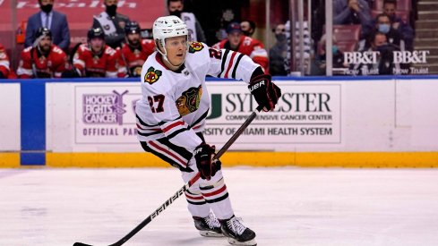 Jan 17, 2021; Sunrise, Florida, USA; Chicago Blackhawks defenseman Adam Boqvist (27) passes the puck against the Florida Panthers during the third period at BB&T Center.