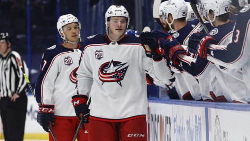 Apr 25, 2021; Tampa, Florida, USA; Columbus Blue Jackets left wing Eric Robinson (50) is congratulated as he scores a goal against the Tampa Bay Lightning uring the third period at Amalie Arena.