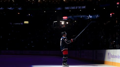 Columbus Blue Jackets defenseman Zach Werenski (8) skates on the ice for being named a star of the game, after scoring the game winning goal against the St. Louis Blues in the overtime period at Nationwide Arena. 