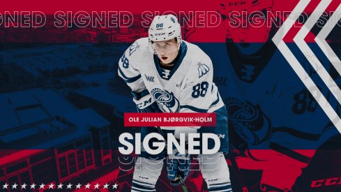 Ole Julian Bjorgvik-Holm signs his entry-level contract.