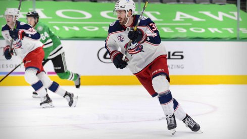 Mar 4, 2021; Dallas, Texas, USA; Columbus Blue Jackets center Boone Jenner (38) skates against the Dallas Stars during the third period at the American Airlines Center.