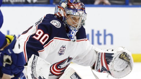 Apr 25, 2021; Tampa, Florida, USA; Columbus Blue Jackets goaltender Elvis Merzlikins (90) reacts against the Tampa Bay Lightning during the third period at Amalie Arena.