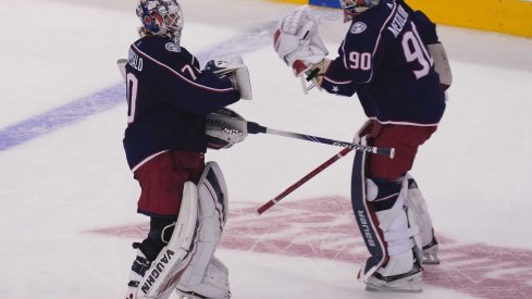 Aug 6, 2020; Toronto, Ontario, CAN; Columbus Blue Jackets goaltender Joonas Korpisalo (70) heads for the bench as he is replaced by goaltender Elvis Merzlikins (90) during the second period against the Toronto Maple Leafs in the Eastern Conference qualifications at Scotiabank Arena.