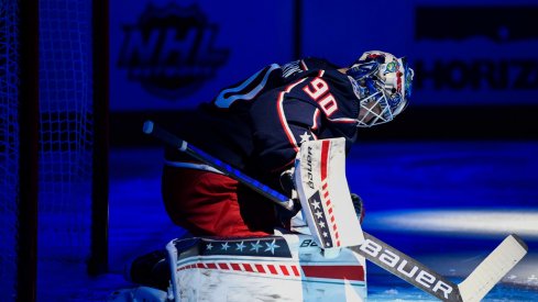 Oct 21, 2021; Columbus, Ohio, USA; Columbus Blue Jackets goaltender Elvis Merzlikins (90) stretches before playing against the New York Islanders at Nationwide Arena.