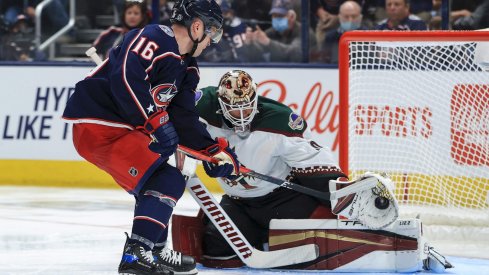 Oct 14, 2021; Columbus, Ohio, USA; Columbus Blue Jackets center Max Domi (16) takes a shot on goal as Arizona Coyotes goaltender Carter Hutton (40) makes a glove save in the third period at Nationwide Arena.