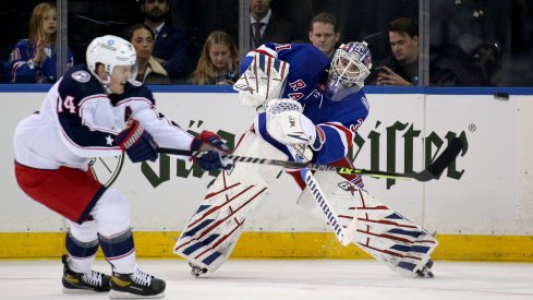 Oct 29, 2021; New York, New York, USA; New York Rangers goaltender Igor Shesterkin (31) plays the puck past Columbus Blue Jackets center Gustav Nyquist (14) during the second period at Madison Square Garden.