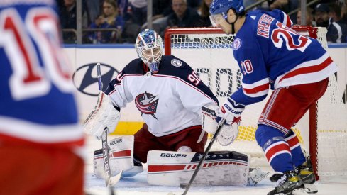 Oct 29, 2021; New York, New York, USA; New York Rangers left wing Chris Kreider (20) scores a goal against Columbus Blue Jackets goaltender Elvis Merzlikins (90) during the third period at Madison Square Garden.