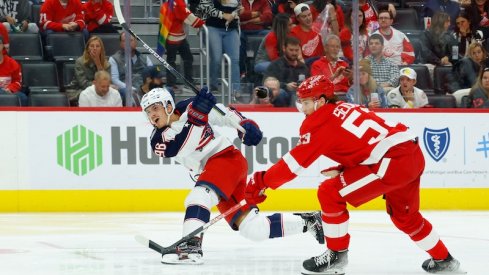 Jack Roslovic takes a shot against the Detroit Red Wings at Little Caesars Arena. 