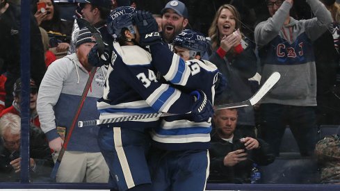 Yegor Chinakhov and Cole Sillinger celebrate Chinakhov's first NHL goal