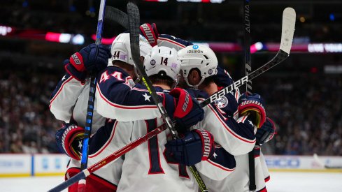 Columbus Blue Jackets forward Yegor Chinakhov (59) celebrates with forward Cole Sillinger (34) after scoring a goal against the Pittsburgh Penguins during the first period at PPG Paints Arena.