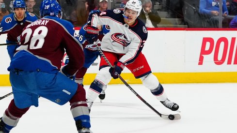 Cole Sillinger with the puck against the Colorado Avalanche 