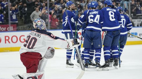 The Toronto Maple Leafs celebrate a goal as Elvis Merzlikins of the Columbus Blue Jackets looks on from Scotiabank Arena.