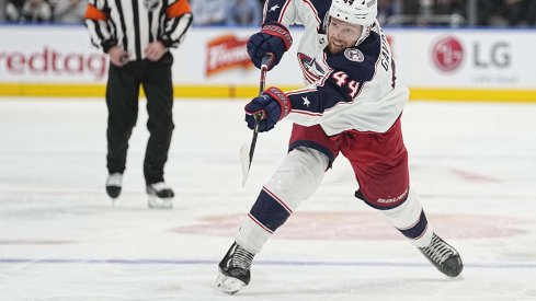 Dec 7, 2021; Toronto, Ontario, CAN; Columbus Blue Jackets defenseman Vladislav Gavrikov (44) shoots the puck against the Toronto Maple Leafs during the second period at Scotiabank Arena.