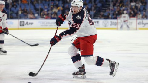 Yegor Chinakhov skates with the puck