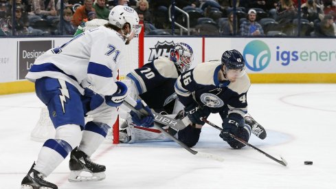 Dean Kukan blocks a shot in his return to the Columbus Blue Jackets' lineup Tuesday in a 7-2 loss to Tampa Bay.