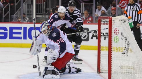 Joonas Korpisalo makes a save for the Columbus Blue Jackets against the New Jersey Devils in the second period at Prudential Center.