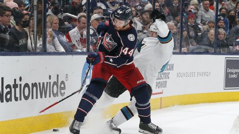 Columbus Blue Jackets defenseman Vladislav Gavrikov checks San Jose Sharks center Tomas Hertl in the third period at Nationwide Arena.